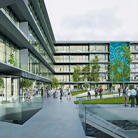Pavimentos urbanos monolíticos en complejo empresarial con acabado continuo y diseño arquitectónico exterior